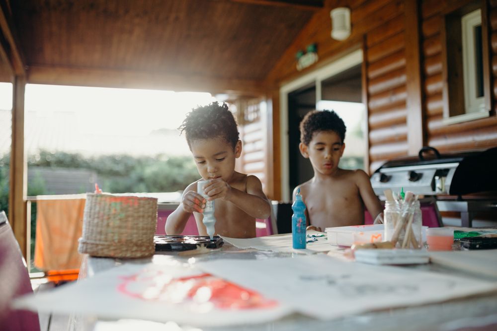 Black kids painting together