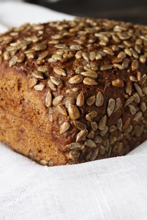 Loaf of bread with grains and poppy seeds