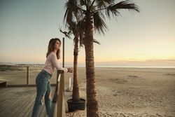 Woman on beach enjoying sunset
