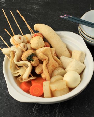 Dinner of Japanese oden, skewers of dumplings and seafood