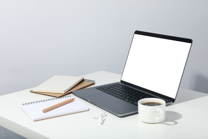 Open laptop with mockup screen with notebooks