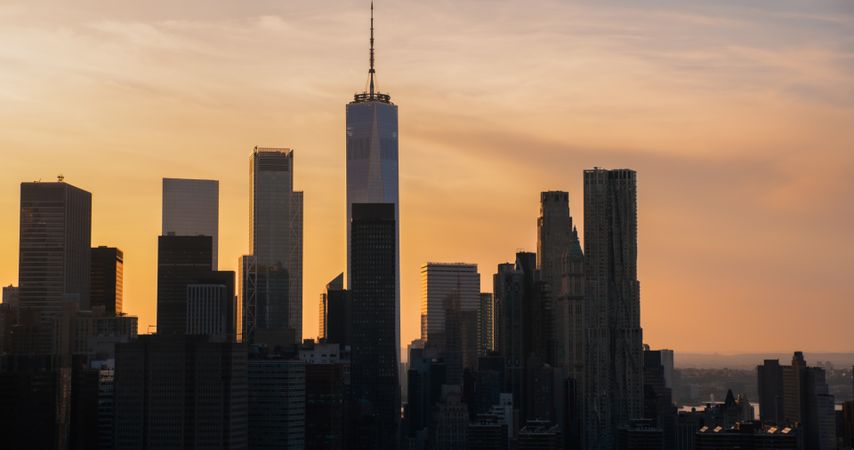 Helicopter Tour of New York City Architecture. Panoramic View of Office Buildings and Skyscrapers in a Warm Evening Sunlight