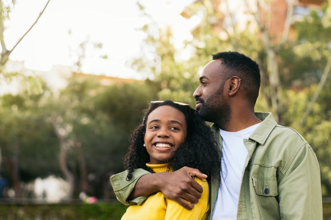 Black man hugging his girlfriend