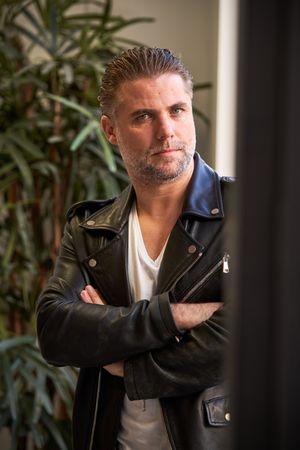 Confident handsome mature man with arms crossed