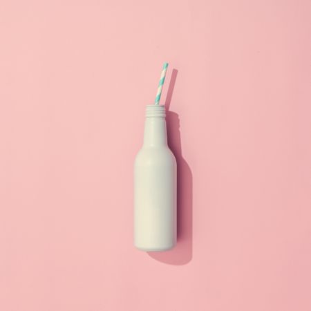 Painted drink on pastel pink background