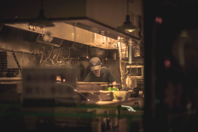 Young man standing in kitchen in one of Japan's restaurant