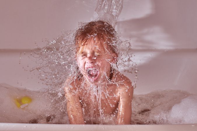 Boy taking bath and yelling