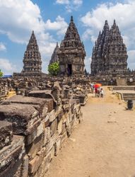 Sulawesi Island, Indonesia - August, 15 2015: Tourists near old temple on cloudy day