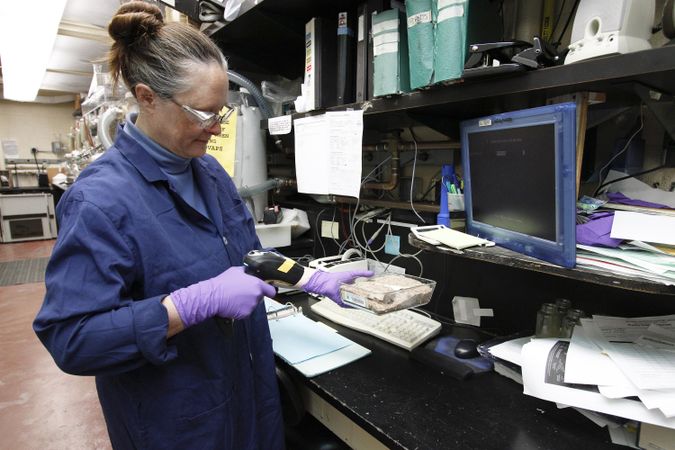 Fort Detrick, MD - USA, Feb 2011: Female scientist in PPE working at the NCI