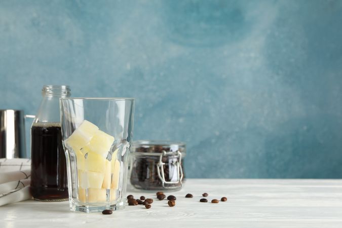 Composition with ice coffee on wooden background