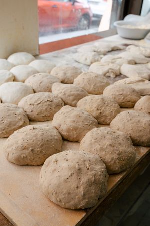 Loaf-shaped bread dough on the table