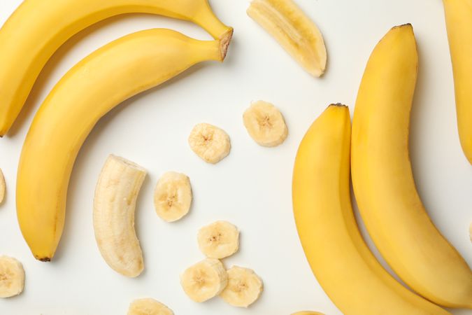 Bananas on light background, top view. Fresh fruit