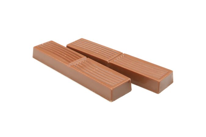 Tasty chocolate pieces isolated on studio background
