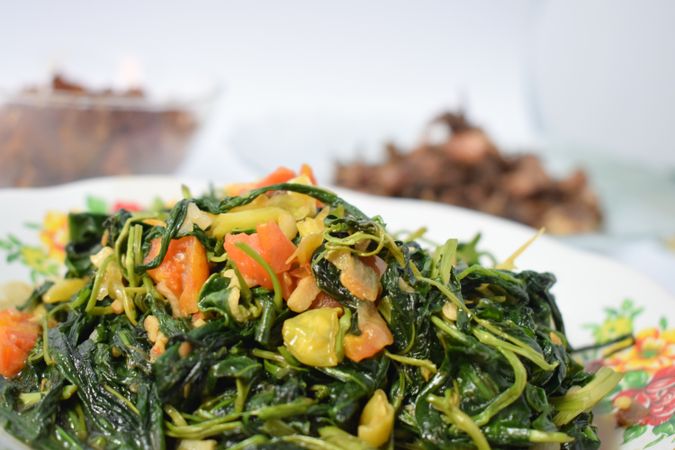 Plate of cooked spinach side dish on table