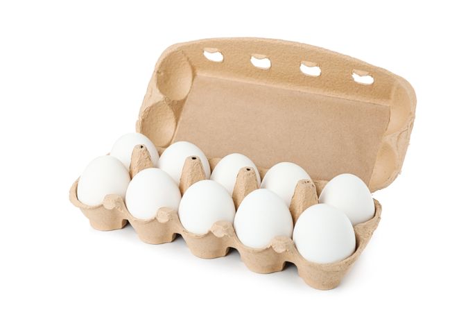 chicken eggs in carton box isolated on blank background