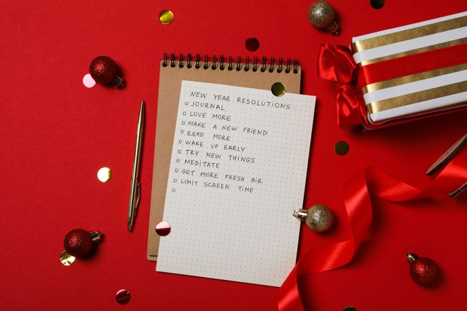 Concept of New Year Resolutions list, new year goals, top view