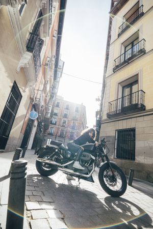 Young woman in custom motorbike