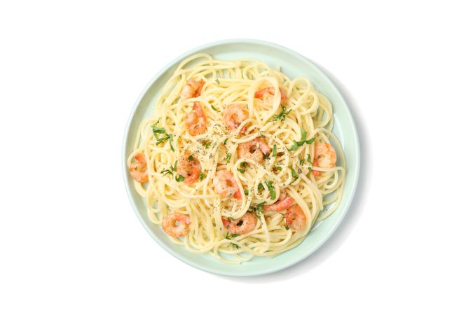 Plate with tasty pasta isolated on plain background