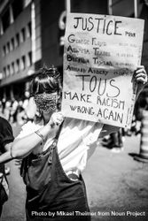 MONTREAL, QUEBEC, CANADA – June 7 2020- protester holding a justice sign during a BLM rally 42kxKb