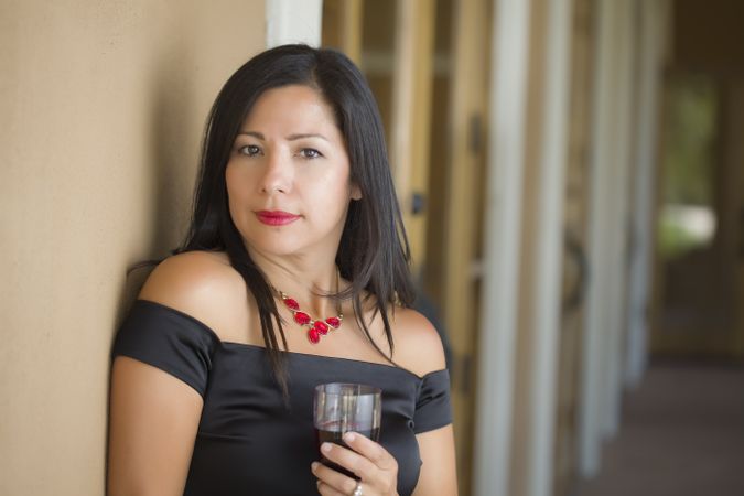 Hispanic Woman Portrait Outside Enjoying Wine
