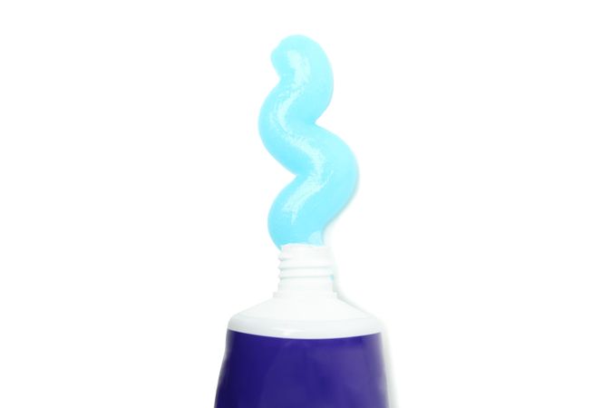 Tube with toothpaste isolated on light background