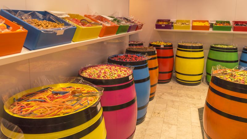 Wooden barrels filled with colorful candies