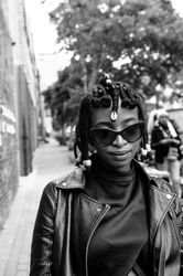 Close up shot of woman outside in the city in fashionable clothing