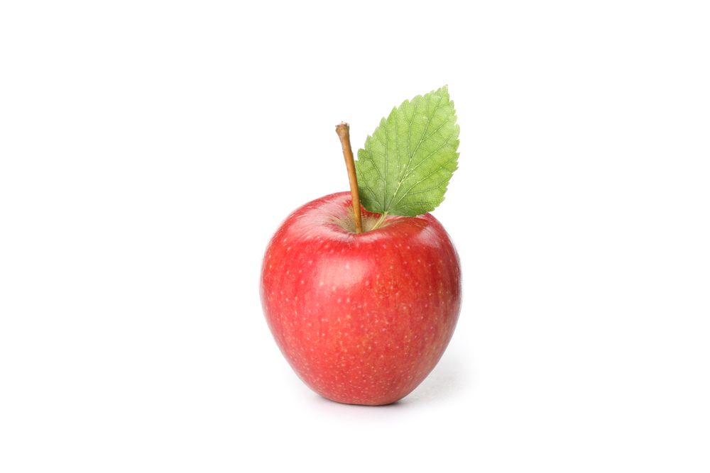 Red apple with leaf isolated on light background