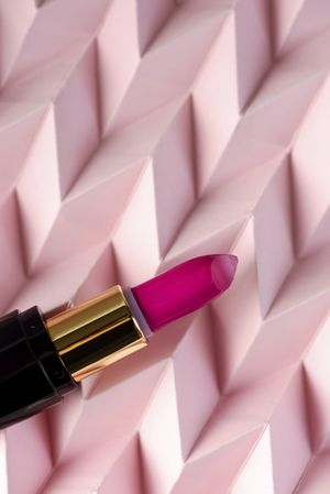 Lipstick on raised pink chevron. Product and make up concept