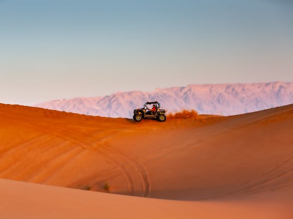 Dark SUV on desert