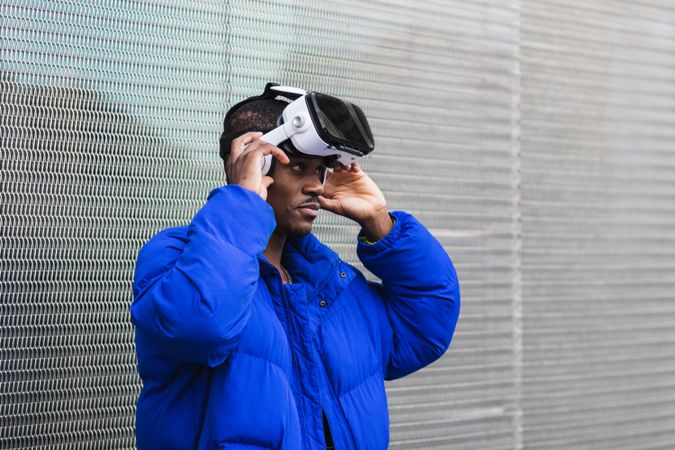 Black man experiencing virtual reality in city