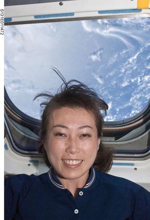 Astronaut Naoko Yamazaki on the AFT Flight Deck of Shuttle Discovery