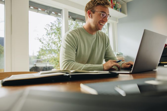 Young father staying at home to work in office