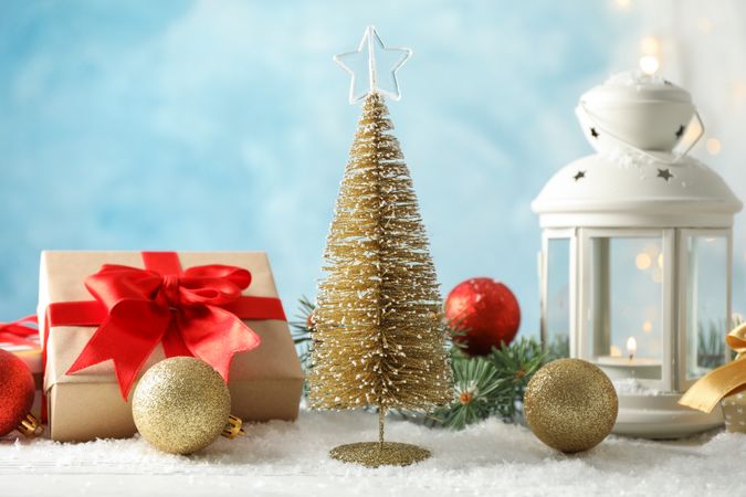 Christmas lantern and tree on decorated background, space for text