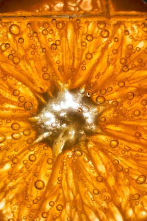 Round orange slice in glass