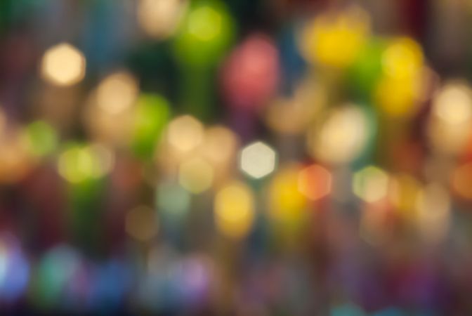 Defocused abstract bokeh lights christmas background, blur of bokeh circle light christmas festive backdrop concept.