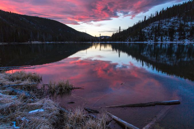 Mirror reflection over lake at sunrise in Yellowstone National Park