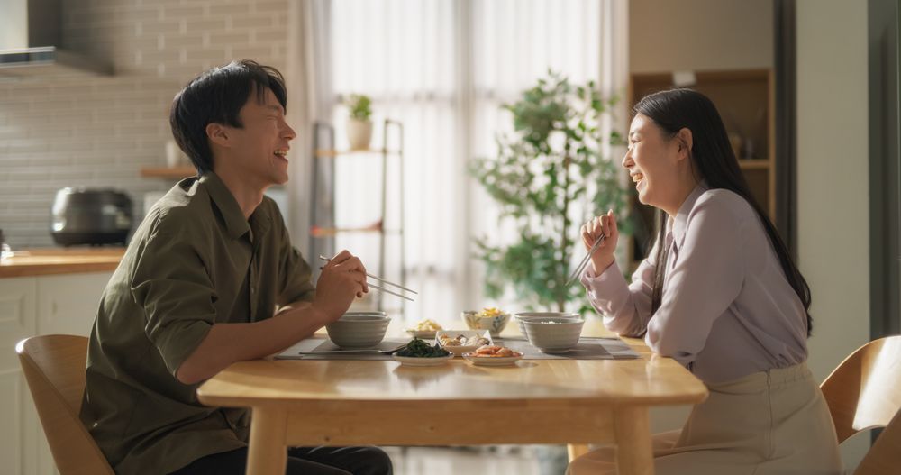South Korean Young Couple Cooked Food at Home and Eating Together in the Kitchen.