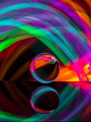 Crystal ball on board near abstract shines