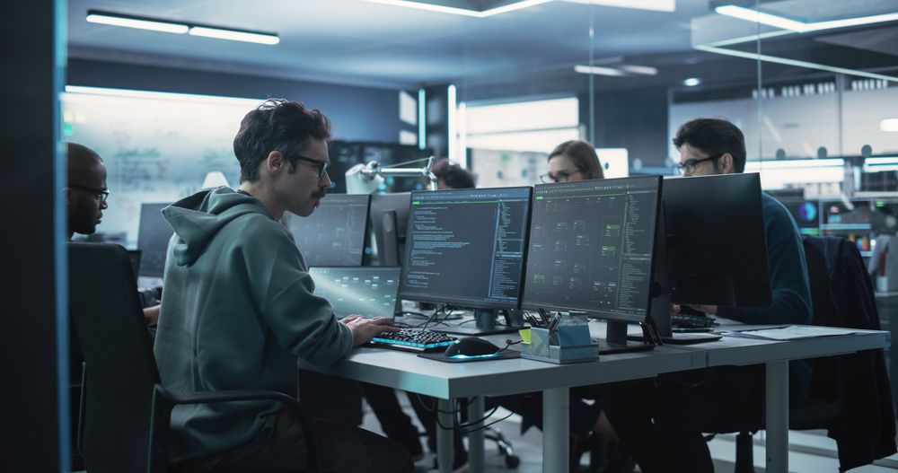 Team of Diverse Multiethnic Software Developers Working on Computers, Programming Advanced Code