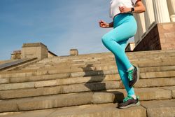 Young woman jogging on city streets