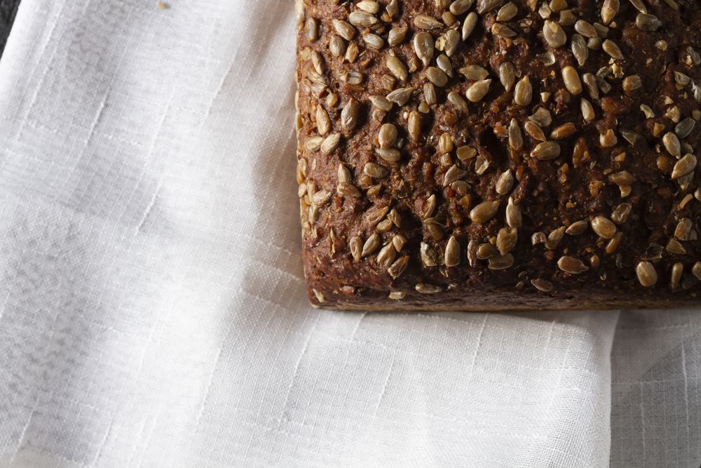 Loaf of bread with grains and poppy seeds