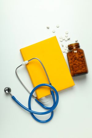 Concept of medical education and books, top view