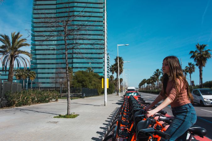 Girl taking a bicycle.