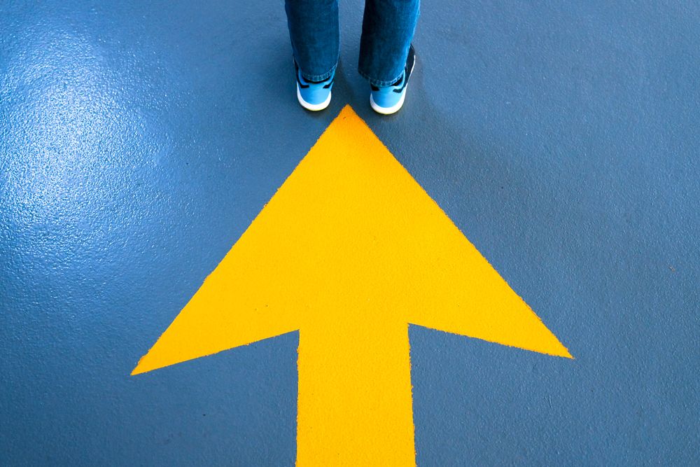 Arrow in ground towards someone feet
