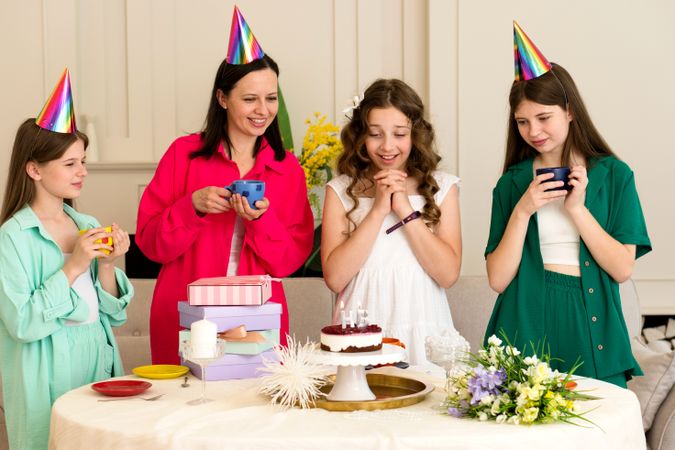 Birthday girl surrounded by family and friends