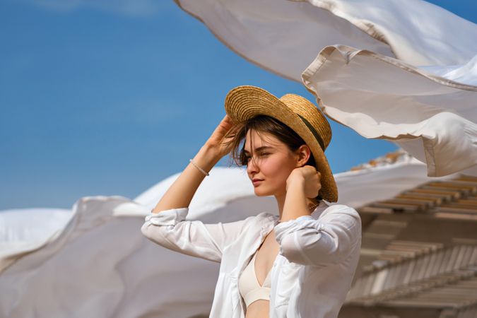 Woman on beach on windy day