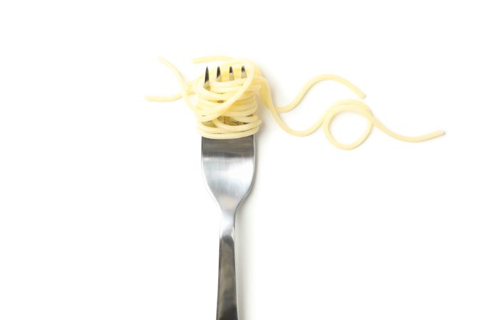 Fork with tasty pasta isolated on blank background