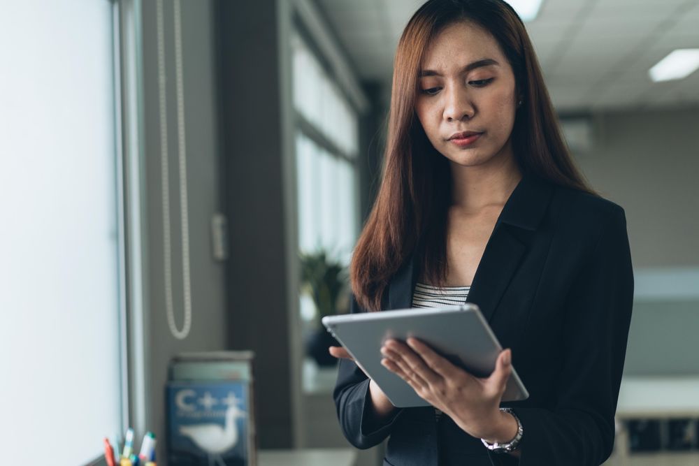 Woman in an office using a tablet