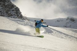 Man skiing on snowboard
